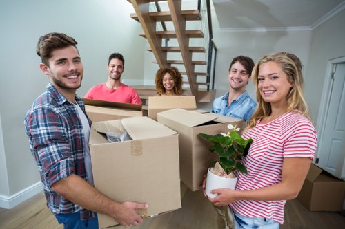 Moving boxes and wrapped furniture prepared by a Chelsea removal company