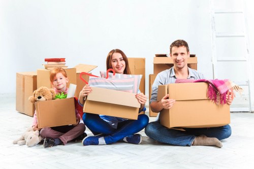 Chelsea home removals team planning a residential move in a narrow London street