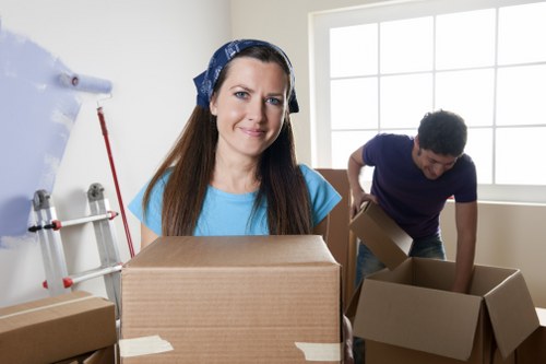 Office furniture, boxes, and equipment prepared for relocation in Chelsea