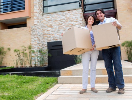 Careful carrying of furniture through a Chelsea property staircase