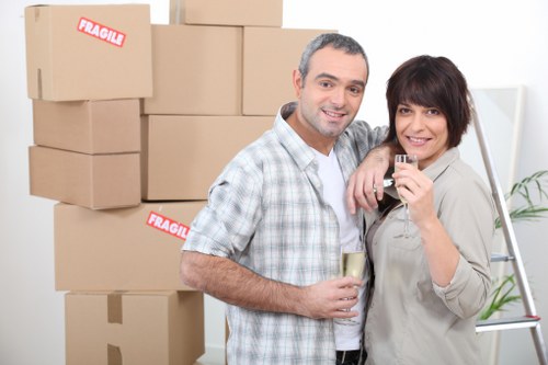 Removal staff handling fragile items with care during transport